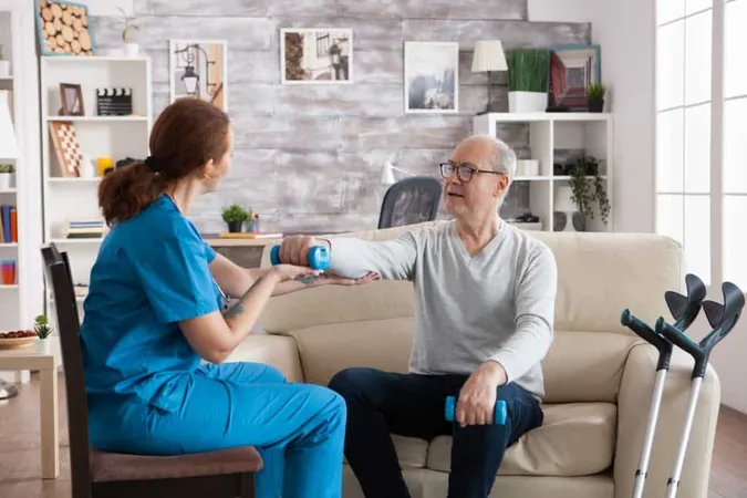 Young Nurse Doing Physiotherapy Treatment Nursing Home With Senior Man Using Dumbbells X - Advanced Stroke Coordinator Certification study guide
