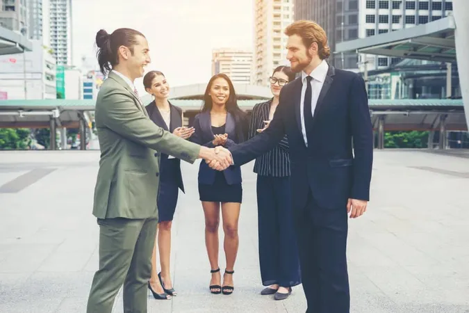 Happy Business People Shaking Hands Business Success X - Certified Franchise Executive study guide