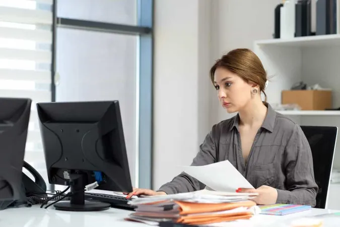 Front View Young Beautiful Lady Grey Shirt Working With Documents Laptop Sitting Inside Her Office Daytime Building Job Activity X - Certified Grant Administrator study guide