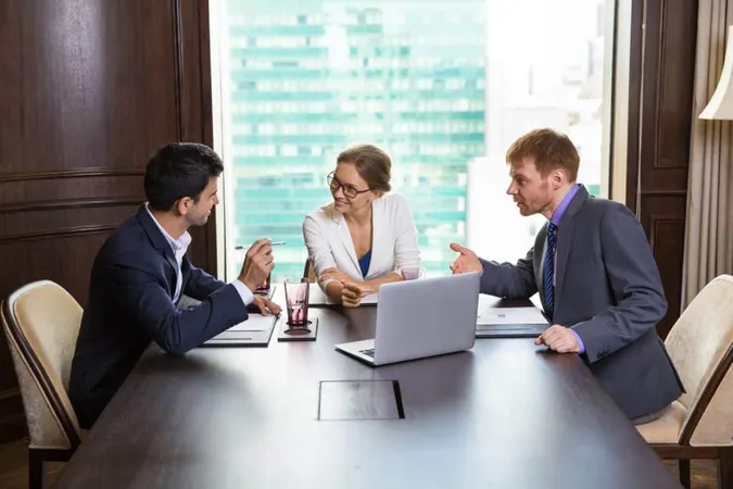 Business Woman Talking With Two Businessmen X - Certified Mobility Consultant study guide