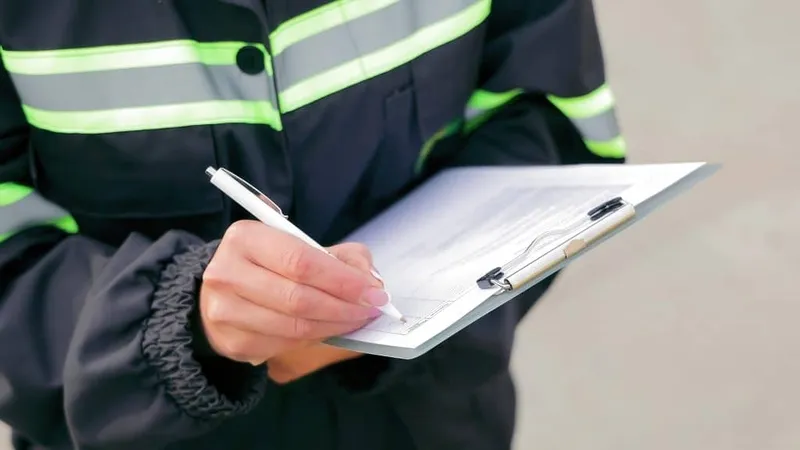 Worker Writing Clipboard Inspection Closeup X - Certified Master Inspector study guide