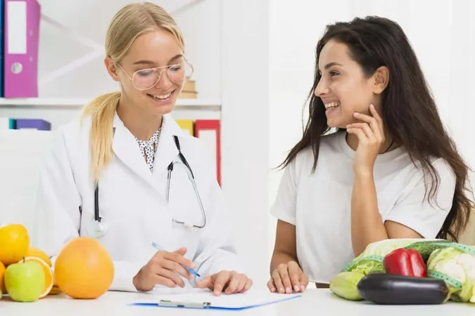 Medium Shot Smiley Doctor Patient Talking X - Certified Nutrition Coach study guide