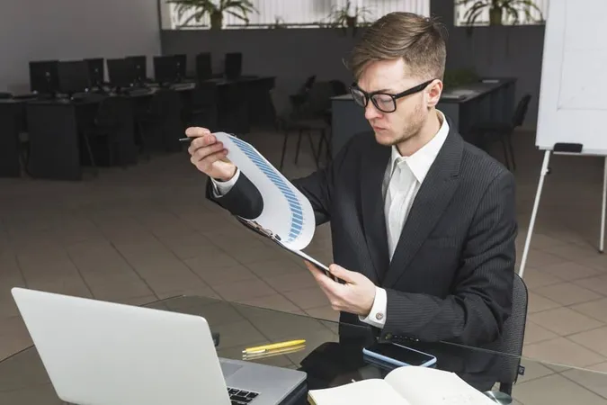 Businessman Analyzing Graph Office X - Certified Pricing Manager study guide