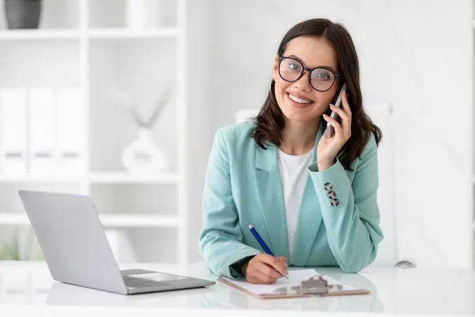 Smiling Millennial Caucasian Lady Secretary Suit Glasses Calls By Phone Workplace X - Certified Professional Secretary study guide