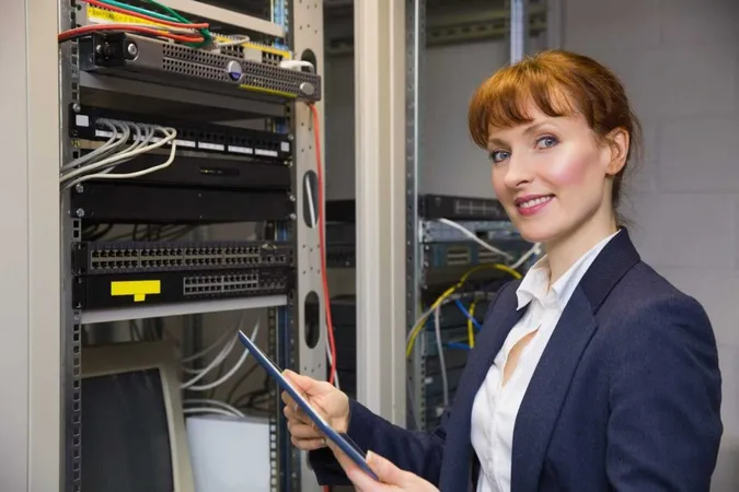 Pretty Technician Using Tablet Pc While Fixing Server X - Certified System Administrator study guide
