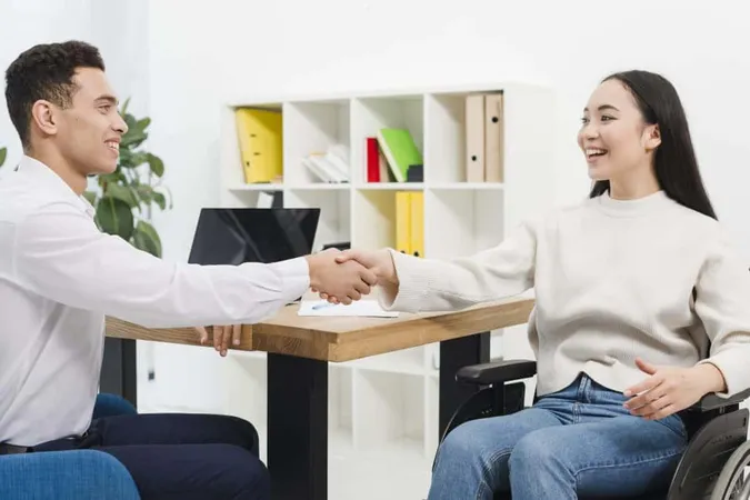 Smiling Young Businesswoman Sitting Wheelchair Shaking Hands With Businessman Office X - Certified Vocational Evaluation Specialist study guide