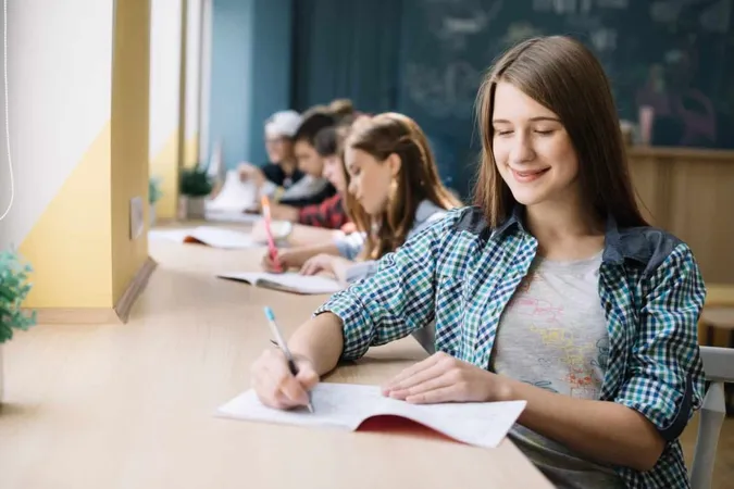 Cheerful Teen Preparing Homework X - Future Aptitude Selection Tool study guide