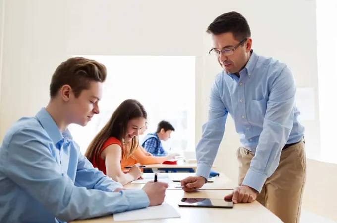 Education School Learning Teaching People Concept Group Students Teacher Talking Classroom X - Professional Teaching Certification study guide