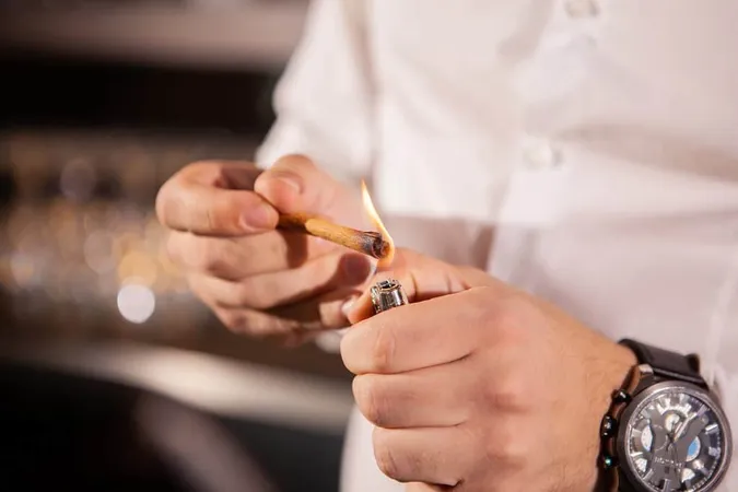 Midsection Man Holding Cigarette X - Responsible Service of Tobacco study guide