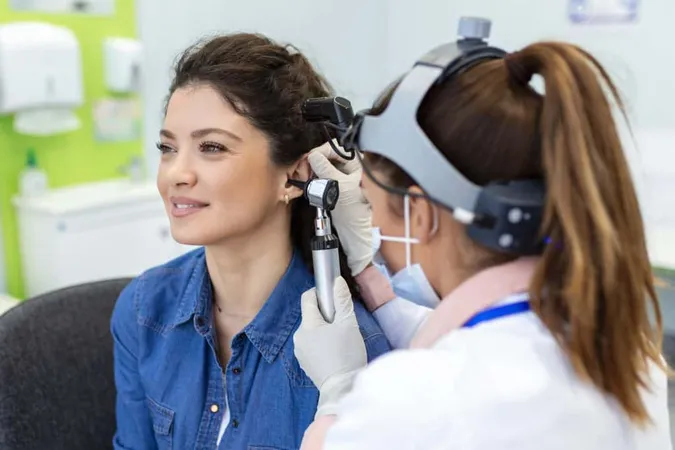 Close Up Female Doctor Carefully Holding Ear His Patient Establish Clearer View Inside His Ear See If He Requires Hearing Aids Modern Clinic X - American Board of Audiology study guide