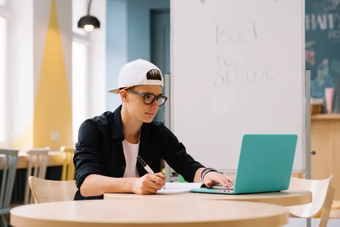 Stylish Student Watching Laptop 1 1 - AMCAT study guide