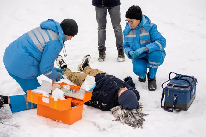 Group Young Paramedics Winter Uniform Squatting Helping Sick Unconscious Man Lying Snow 1 X - Avalanche Safety Certification study guide