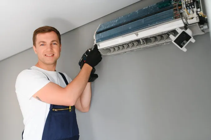 Male Technician Fixing Air Conditioner Indoors X - Air Systems Cleaning Specialist Certification study guide