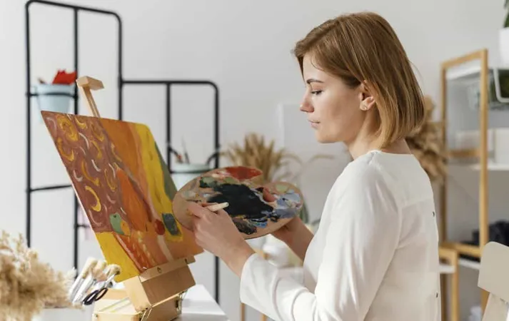 Young Blonde Woman Painting With Acrylics X - Art Therapist Certification study guide
