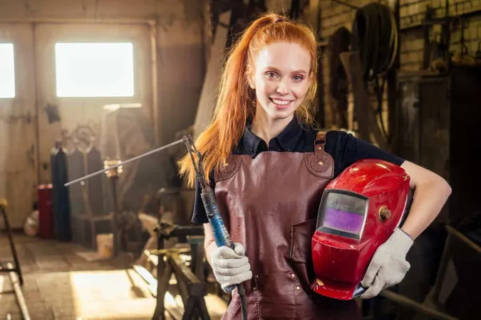 Strong Worthy Pretty Redhead Ginher Woman Wearing Protection Helmet Leather Apron With Gloves Holding Welding Machine Instrument Small Business Concept X - AWS Certified Welder study guide