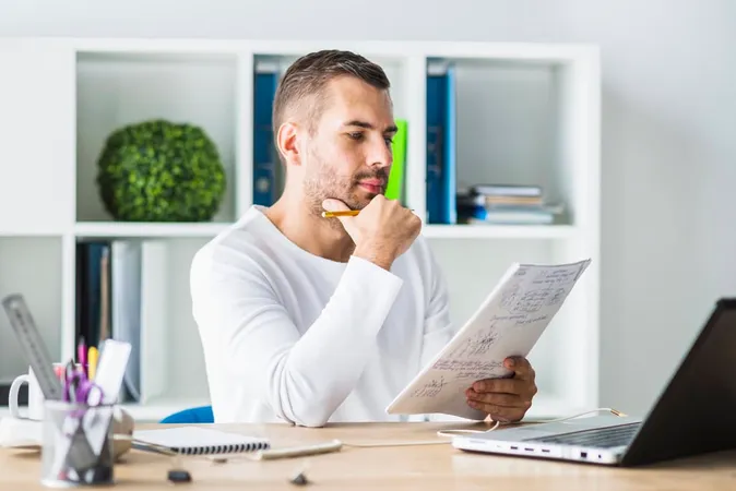 Young Businessman Looking Docume - Blog study guide