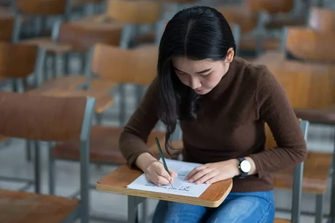 Young Woman Sitting Table X - Blog study guide