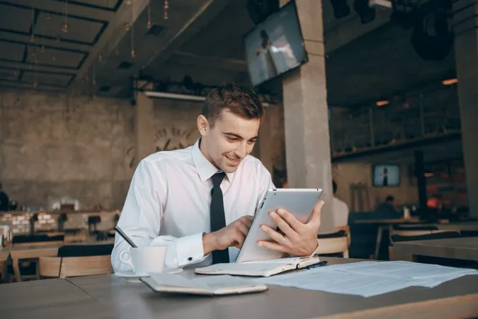 Workplace Cafe One Businessman Reading X - Chartered Certified Accountant study guide