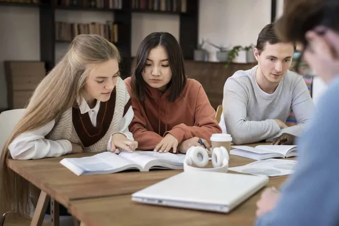 Young Students Learning Together Group Study X - Certified Academic Mentor study guide