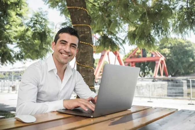 Man With Laptop Outdoors X - Certified Application Specialist study guide