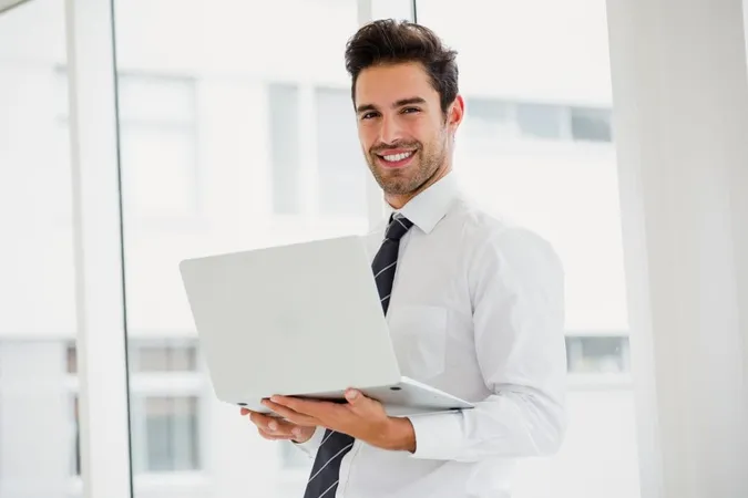 Businessman Using Laptop Taking Notes X - Certified Blockchain Consultant study guide