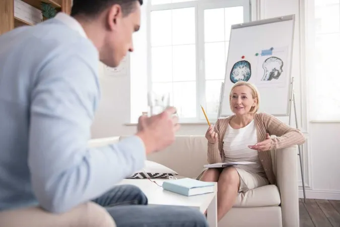Professional Opinion Successful Mature Psychologist Using Notebook While Helping Man X - Cognitive Behavioral Therapy Certification study guide