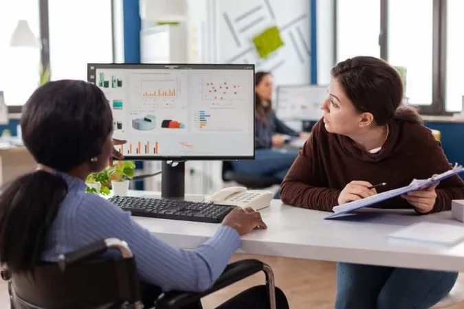 Businesswoman Discussing With Disabled Woman X - Certified Career Analyst study guide