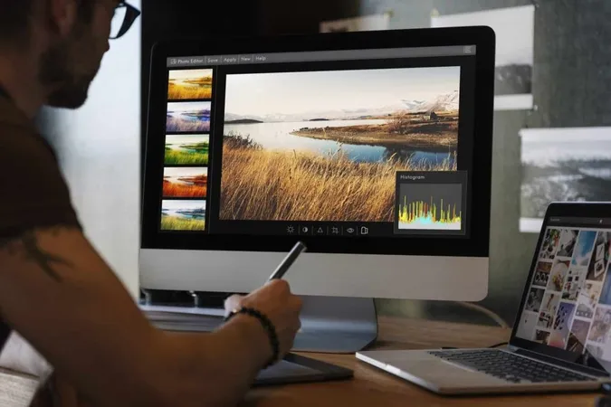 Man Editing Photos Computer X - Canva Certified Creative study guide