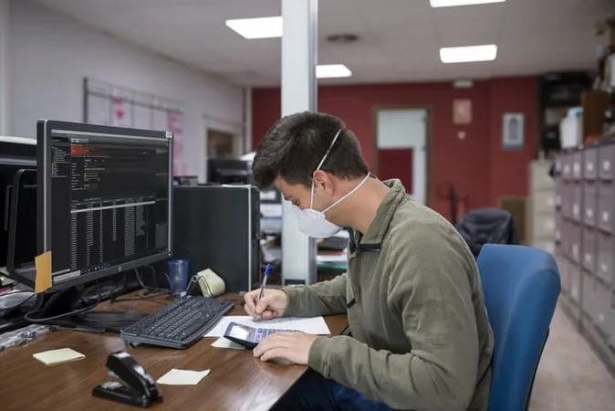 Side View Man Working Table - Certified Computer Examiner study guide