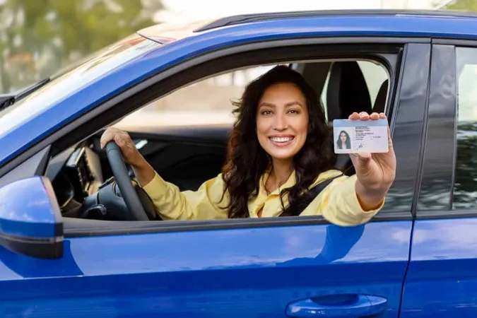 Smiling Female Student Driver Sitting Car Showing Her Driving Car License Camera Being X - Comprehensive Driver’s Education study guide