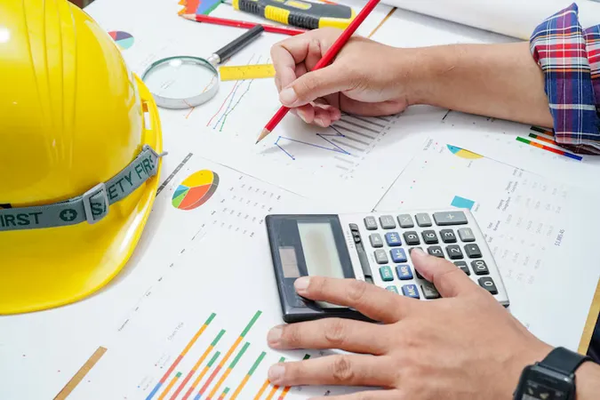 Architect Engineer Working Project Accounting With Graph Office - Certified Estimating Professional study guide
