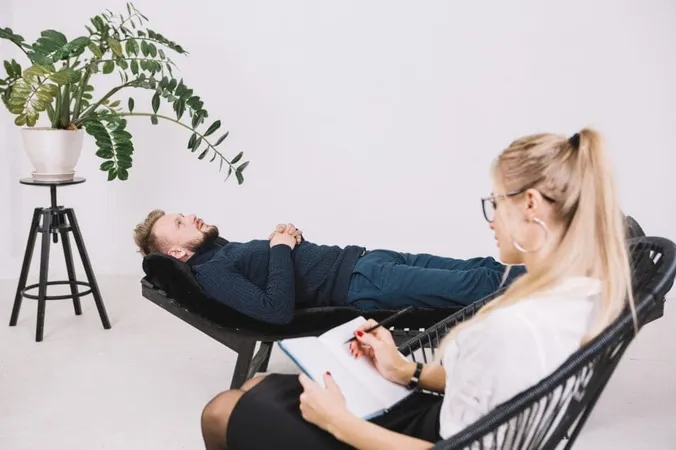 Female Psychologist Writing Notes Diary While Patient Lying Couch Clinic X - Certified BodyTalk Practitioner study guide