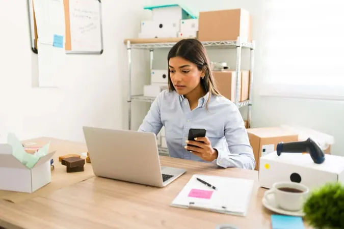 Hispanic Young Woman Her Office Looking Her Laptop Smartphone Check Customers Orders Her Online Beauty Shop X - Certified Ecommerce Specialist study guide