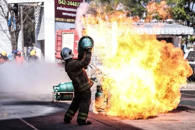 Side View Firefighter Carrying Cylinder While Standing Road X - Certified Explosives Specialist study guide