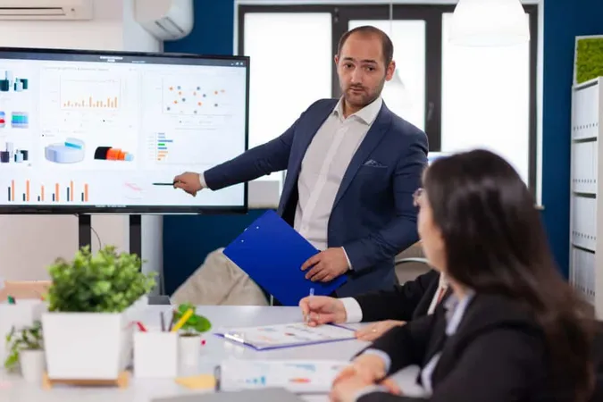 Successful Team Leader Briefing Pointing Explaining Project Conference Room Brainstorming X - Certified Fintech Practitioner study guide