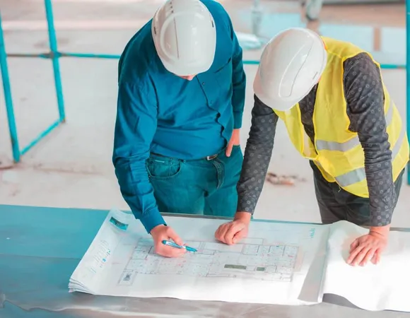 Two Colleagues Working Project X - Certified Health Care Constructor study guide