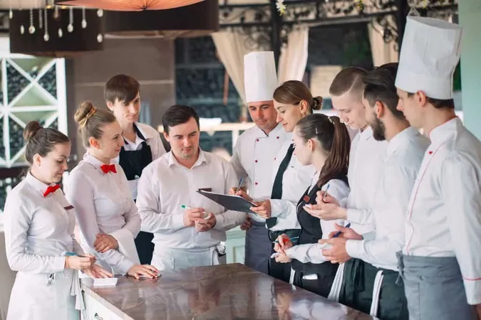 Restaurant Manager His Staff Terrace Interacting Head Chef Restaurant X - Certified Hospitality Educator study guide