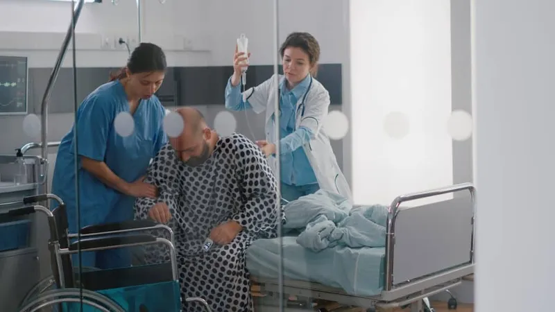 Medical Team Helping Sick Patient With Leg Injury Fracture Putting Wheelchair X - Certified Healthcare Transporters study guide