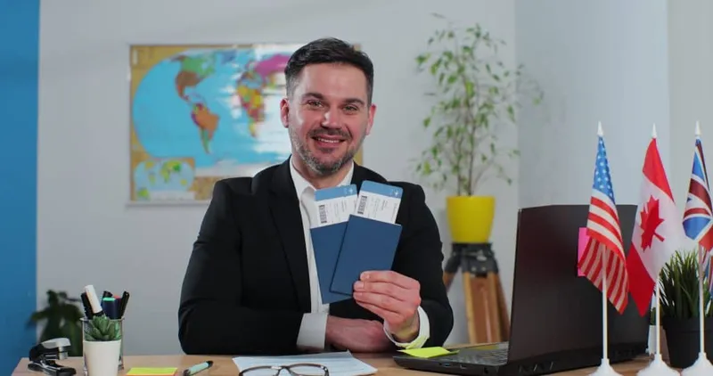 Portrait Successful Happy Man Travel Agent Travel Agency With Passports Tickets Concept Tourism Travel X - Certified Immigration Consultant study guide