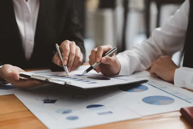 Vecteezy Businessman Meeting And Working With Financial Report X - Certified Market Analyst study guide