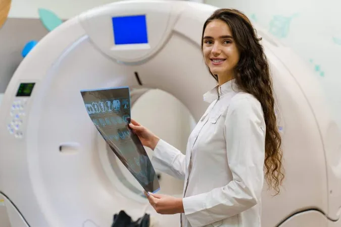 Young Women Doctor Medical Gown Looks Results Ct Scanner X - Certified Medical Dosimetrist study guide