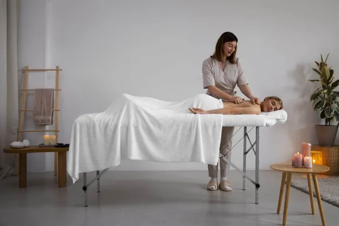 Woman Getting Back Massage From Masseur X - Certified Massage Practitioner study guide