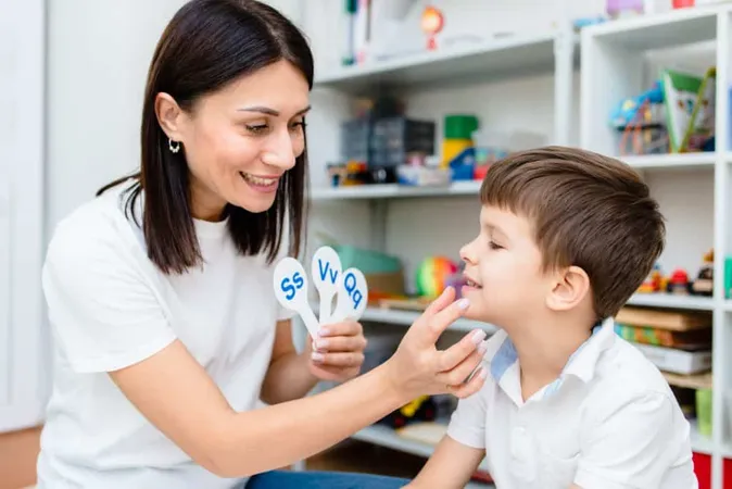 Cute Boy With Speech Therapist Is Taught Pronounce Letters Words Sounds X - Certified Myofunctional Therapist study guide
