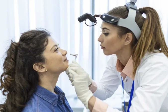 Doctor Otorhinolaryngologist Checking Nose With Otoscope Patient Hospital Nasal Congestion Sinusitis Allergy Concept X - Certified Orofacial Myologist study guide