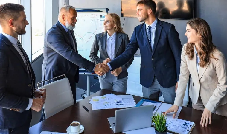 Business People Shaking Hands Finishing Up Meeting X - Chartered Professional in Human Resources study guide