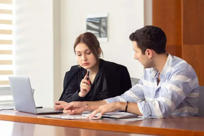 Front View Young Beautiful Businesswoman Black Shirt Black Jacket Along With Young Man Discussing Work Issues Inside Her Office Work Job Building X - Certified Provisional Interpreter study guide