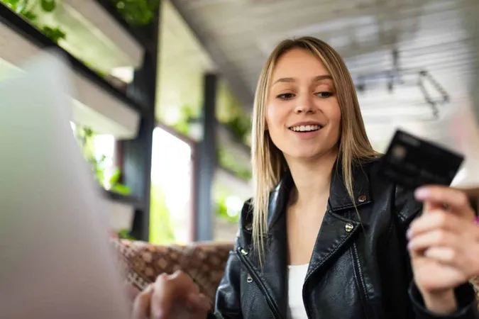 Woman Using Laptop Computer Pay Bill Online X - Certified Payment Professional study guide