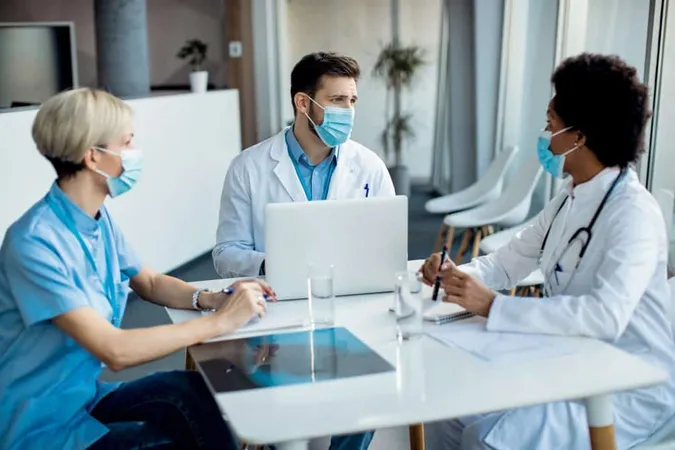 Group Healthcare Experts With Face Masks Talking Meeting Medical Clinic X - Certified Prevention Professional study guide