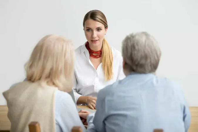 Female Financial Advisor Talking Consulting Senior Aged Couple Meeting X - Certified Retirement Counselor study guide