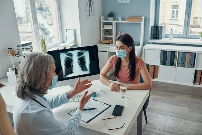 Mature Female Doctor White Lab Coat Talking Young Woman While Sitting Her Office X - Certified Respiratory Educator study guide